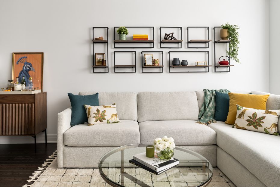 Custom Sectional Townhouse Living Room Living area in open-concept townhouse with large custom sectional and round glass coffee table